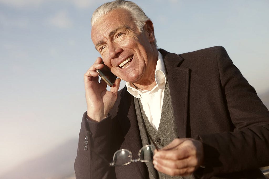 An older gentleman on the phone
