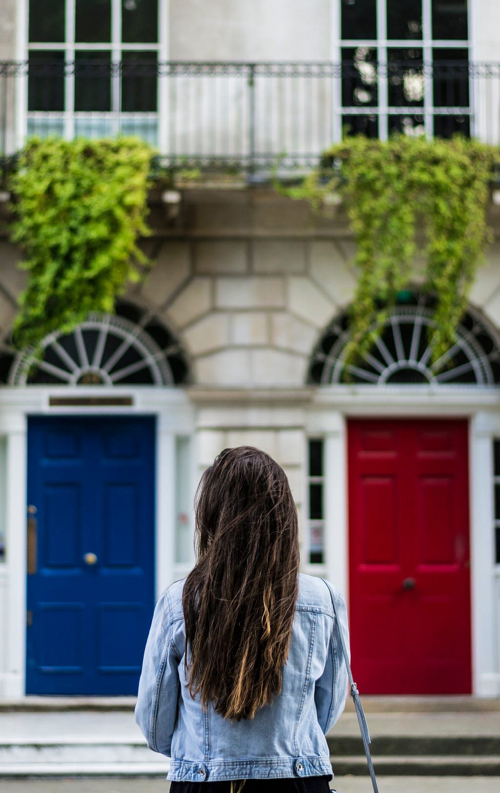 Woman choosing between two doors