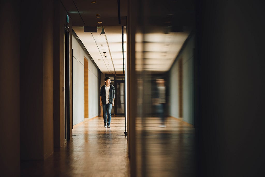 A student walking in the hallway.