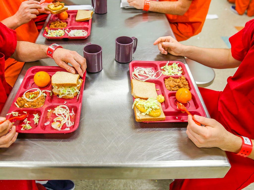 Immigrant detainees eat lunch at the Adelanto Detention Facility in California in 2013.