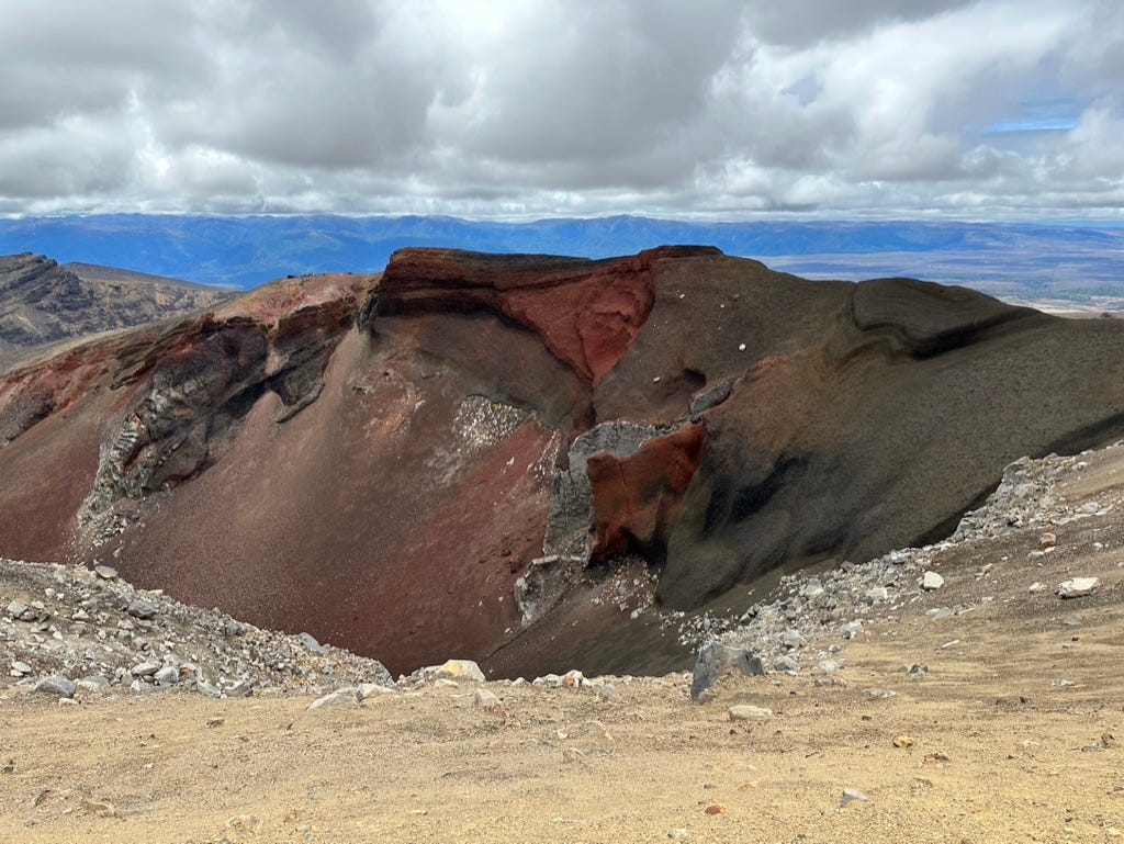 Red rocks in a crater.