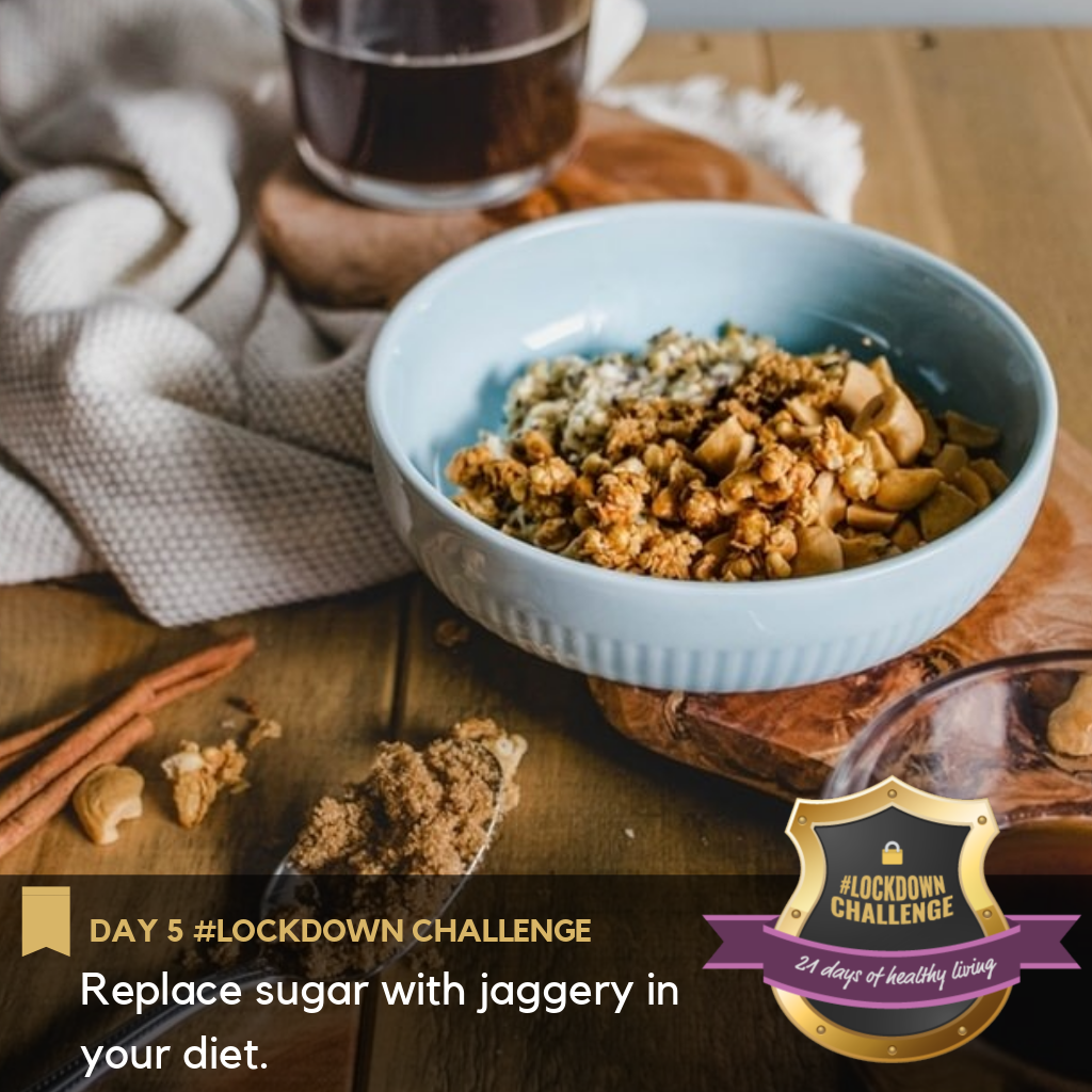 A bowl of granola with a tablespoon of jaggery