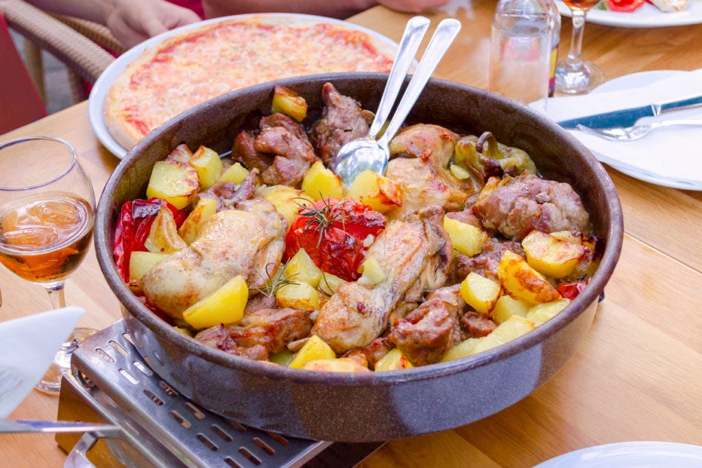 Traditional croatian food peka with mix meat and vegetables