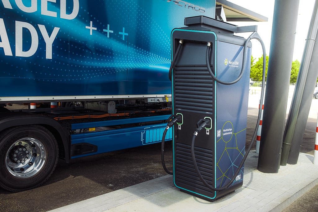 Electric logistics truck at a charging point.