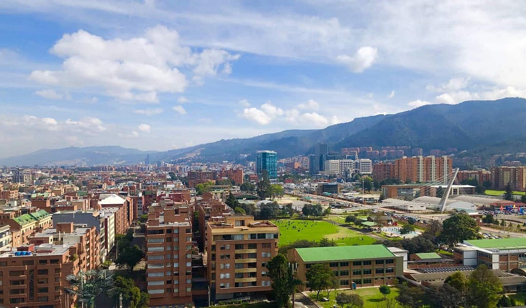 skyline of Bogotá, Colombia, with the city in the foreground and mountains in the background