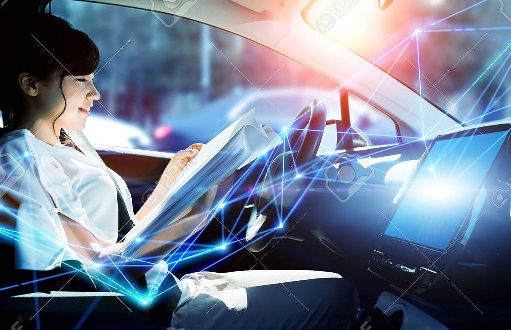 A young woman reading while the car moves autonomously, representing the autonomous technology.