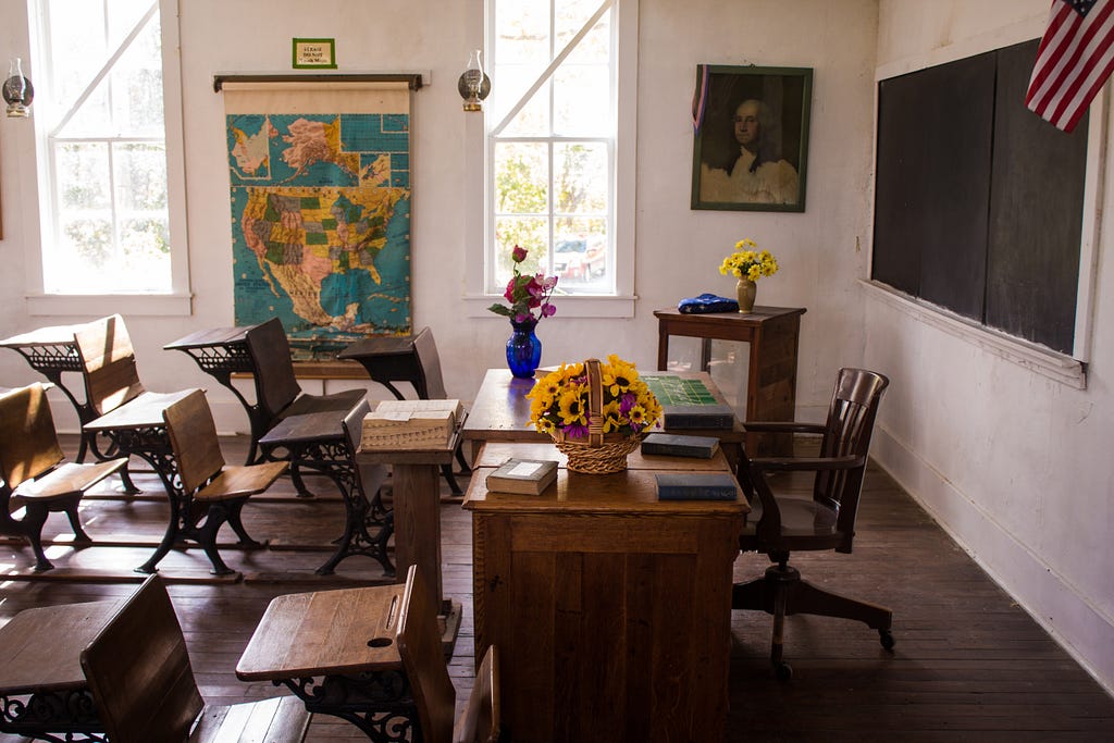 An old-fashioned American classroom, similar to the ones in my elementary school days.