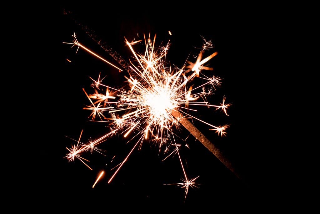 Sparks flying out of a sparkler