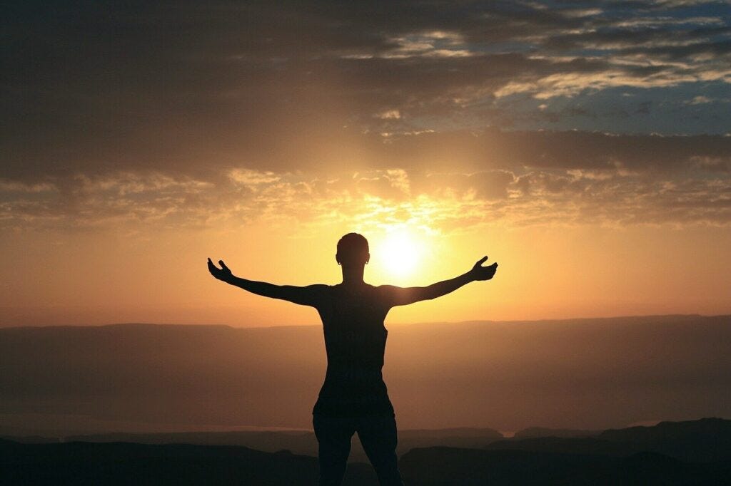 woman watching sunset