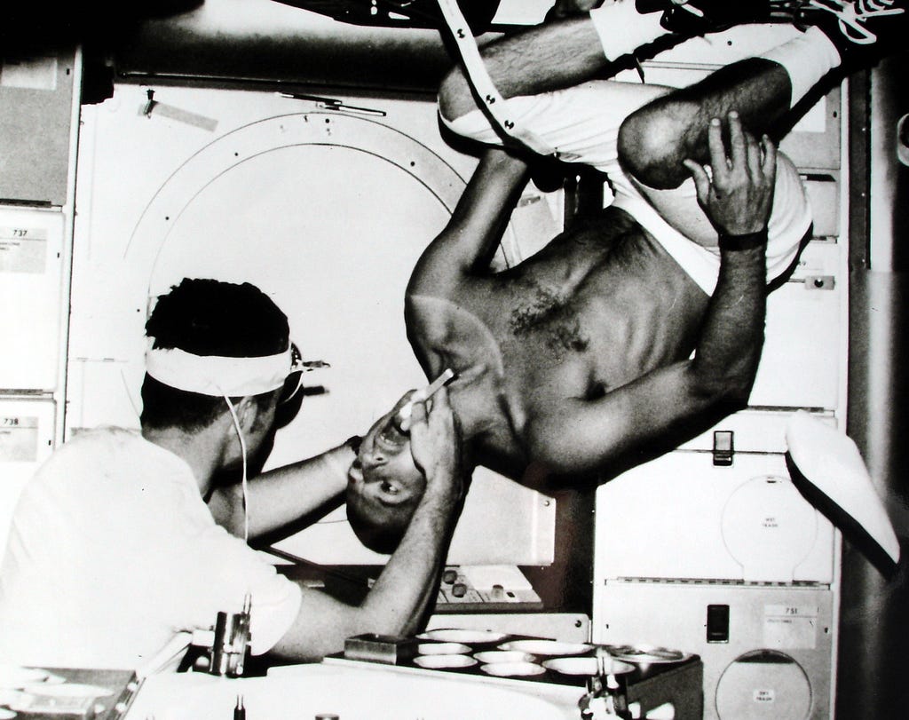 Pete Conrad having a weightless dental check-up, 1973