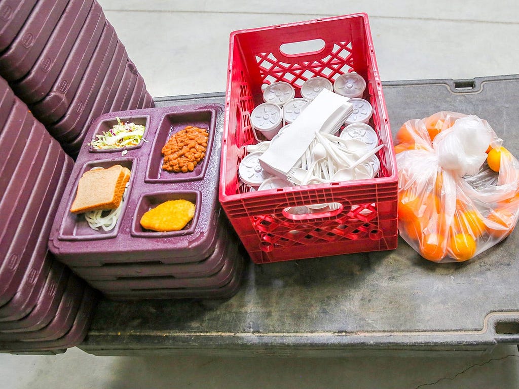 Lunch waits to be served to immigrant detainees in their ‘segregation cells’ at the Adelanto Detention Facility.