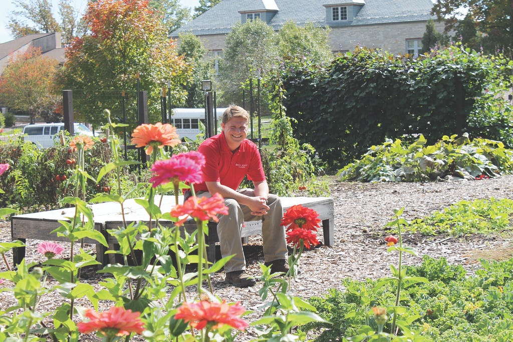 A college garden is cared for by Micah Alden, a student coordinator. 
