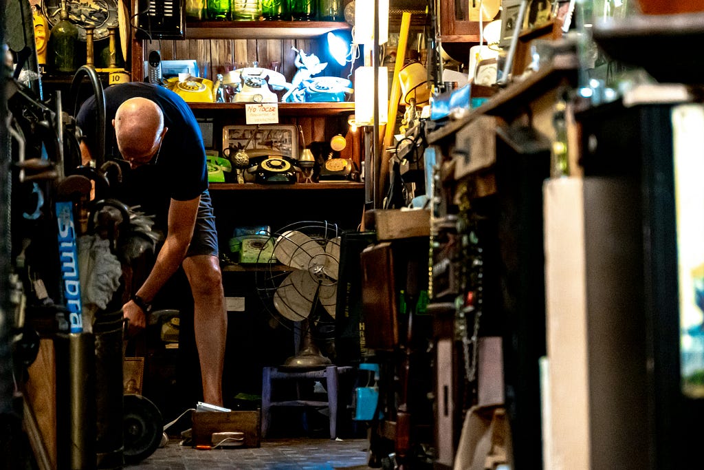 A man shown in a hoarding situation.