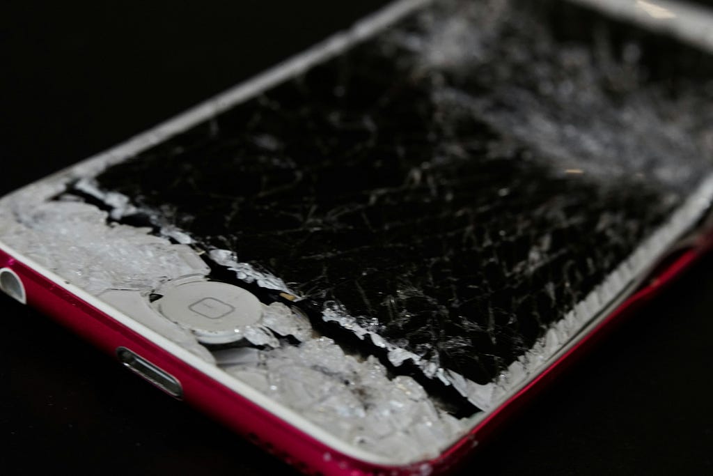 Cell phone with smashed screen.