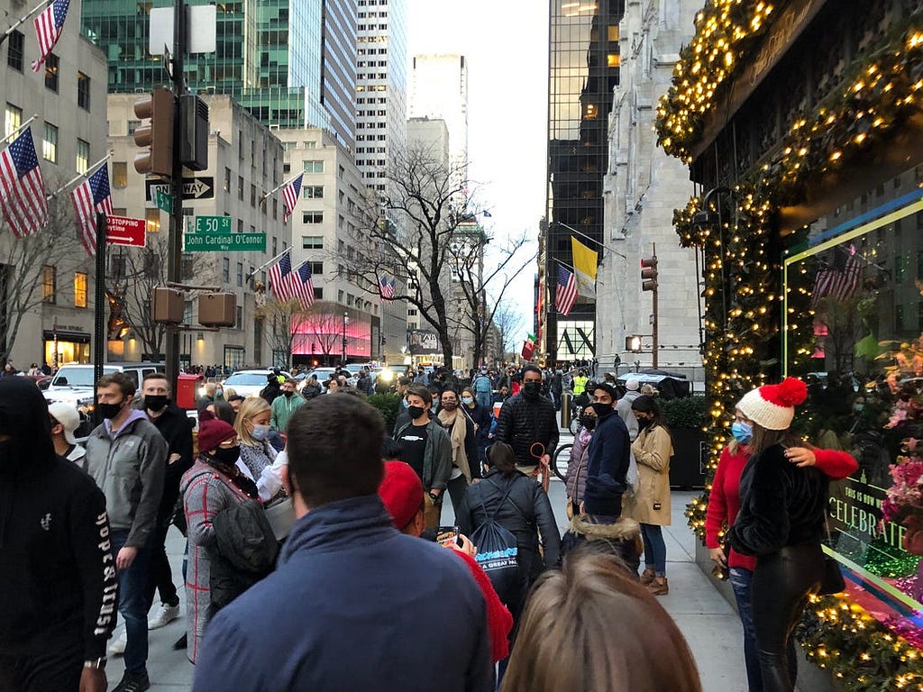 A busy sidewalk on Fifth Avenue.