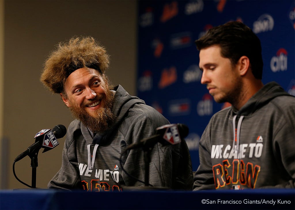 Hunter Pence and Buster Posey answer questions during a press conference.