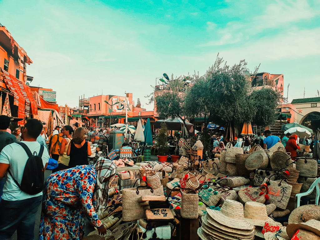 an outdoor bazaar (market) under a blue sky
