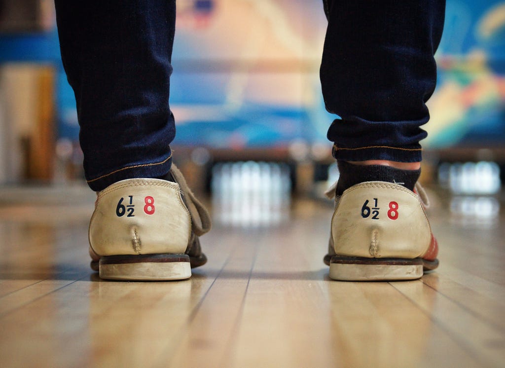 A shot of someone’s bowling shoes. Very arty.