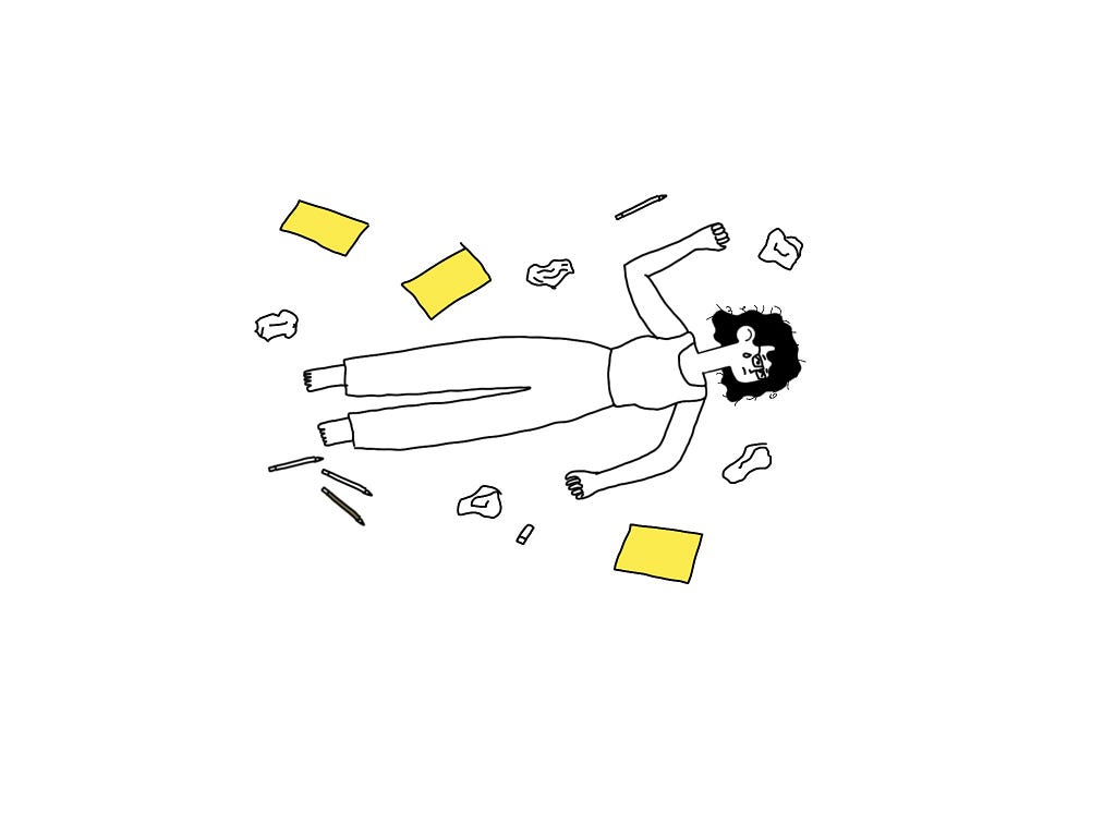 Cartoon person lying amongst crumpled papers