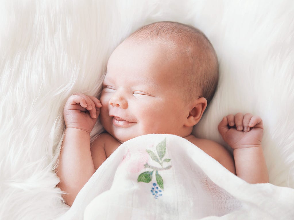 New born baby smiling in sleep