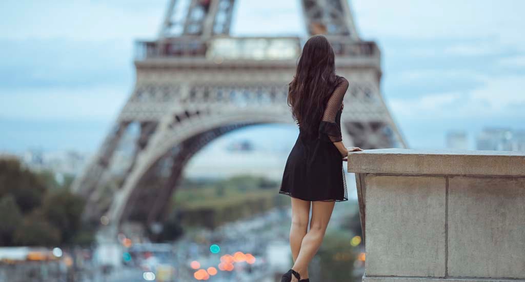 Entrepreneur standing in front of Eiffel Tower in Paris