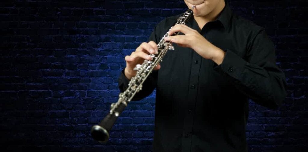 man playing oboe