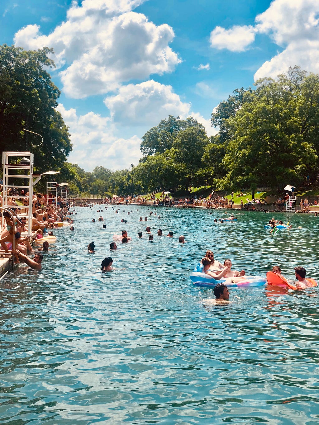 Barton Springs Pool full of people in the summer.