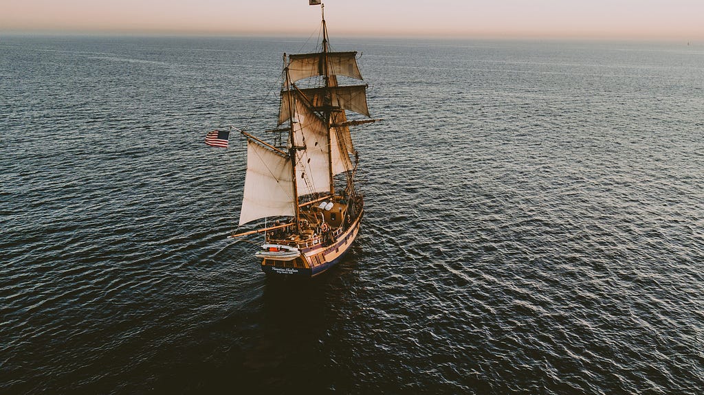 An ancient ship on the ocean.