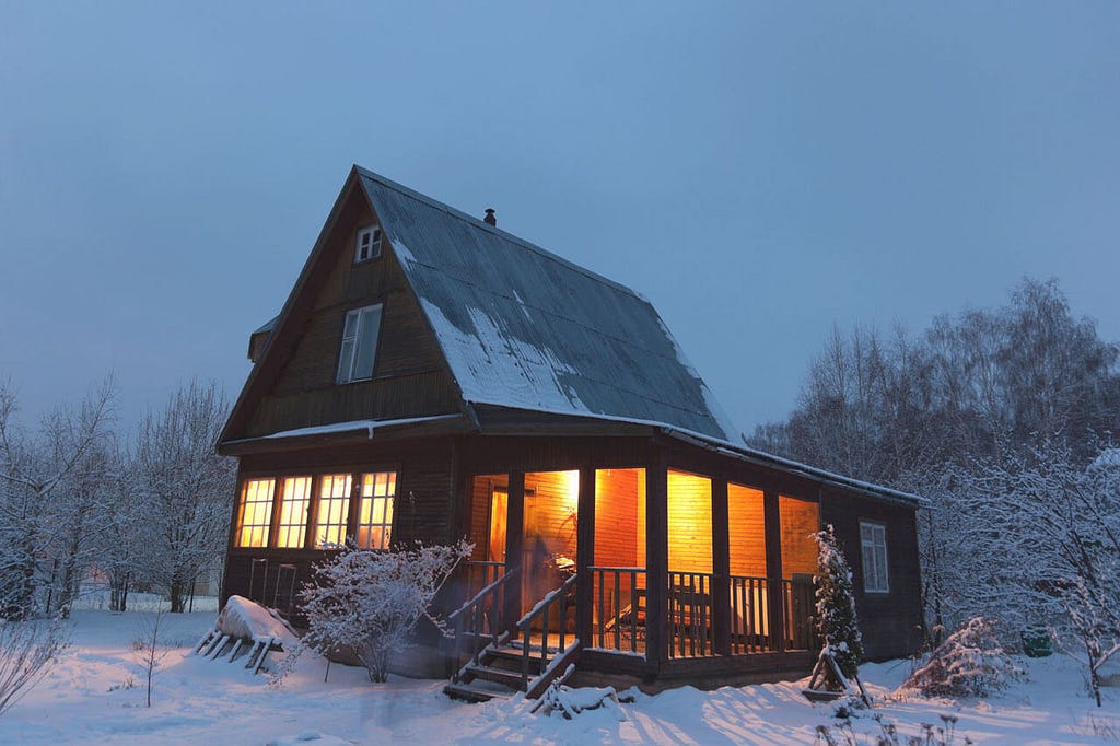 a cozy cabin in a winter landscape as a place to slow down