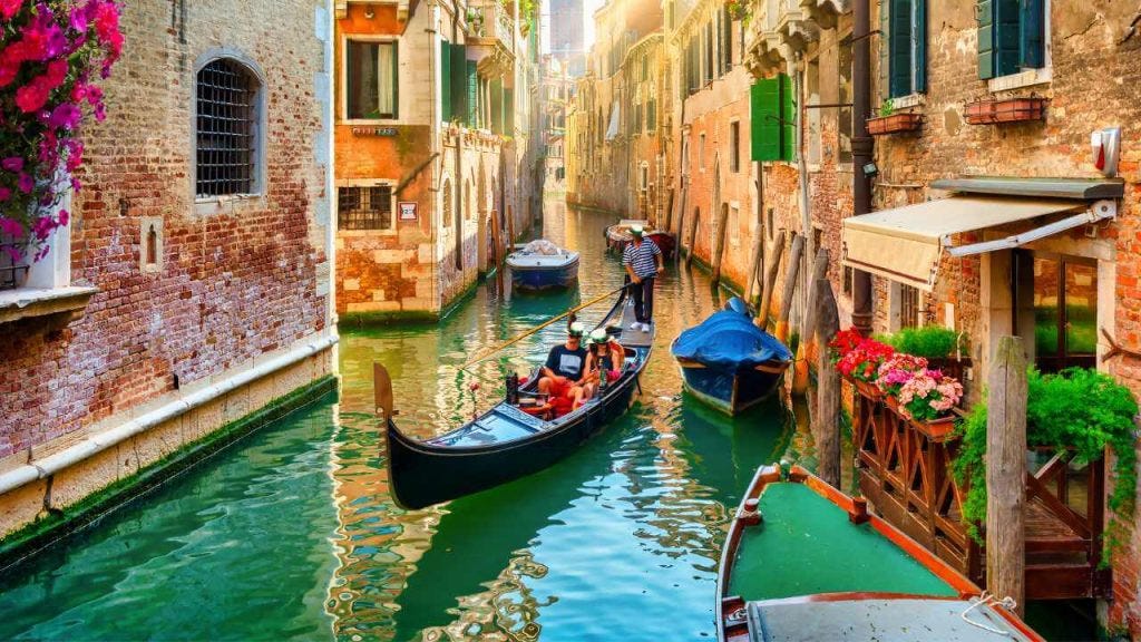 Explore the winding canals and narrow streets of Venice