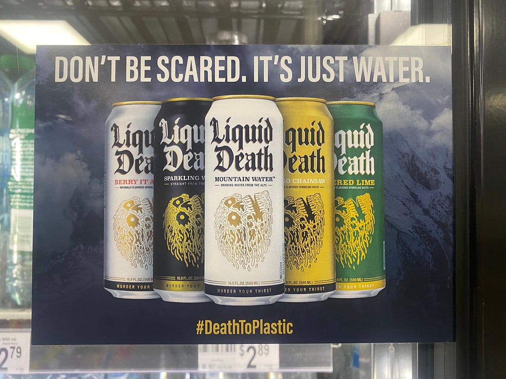 Liquid Death poster on a fridge door.