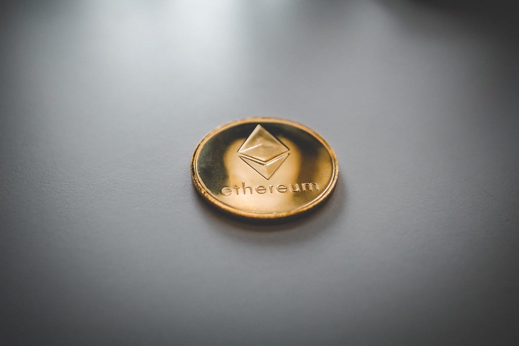 A coin with the word “ethereum” on it