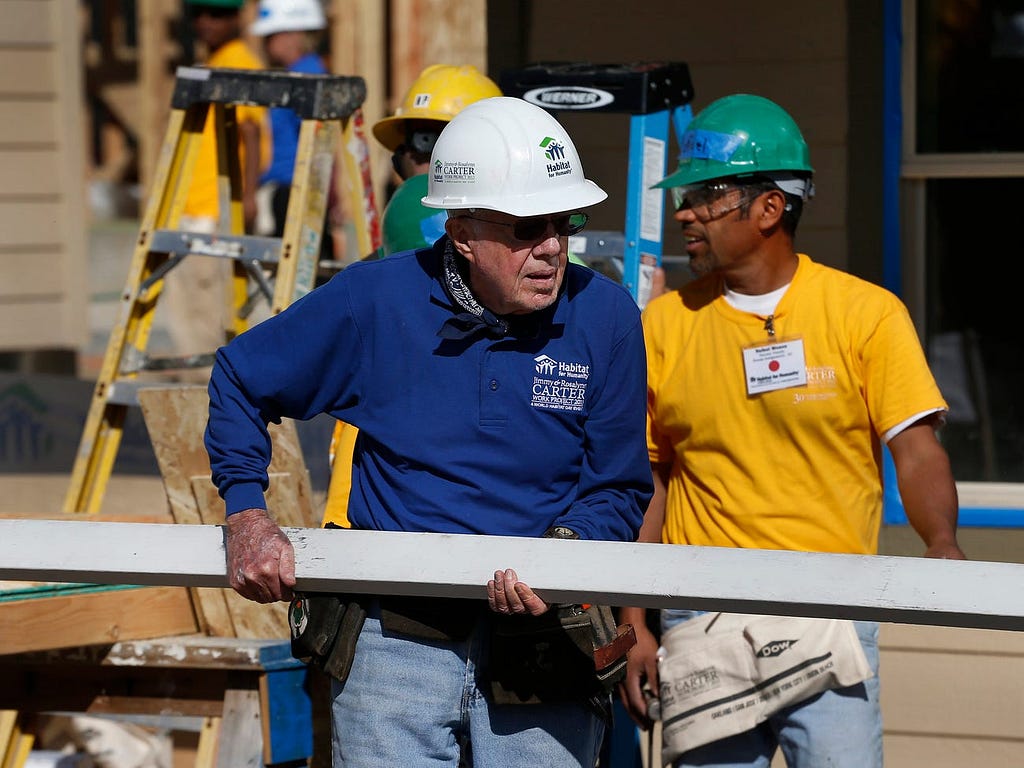 Jimmy Carter doing construction work.