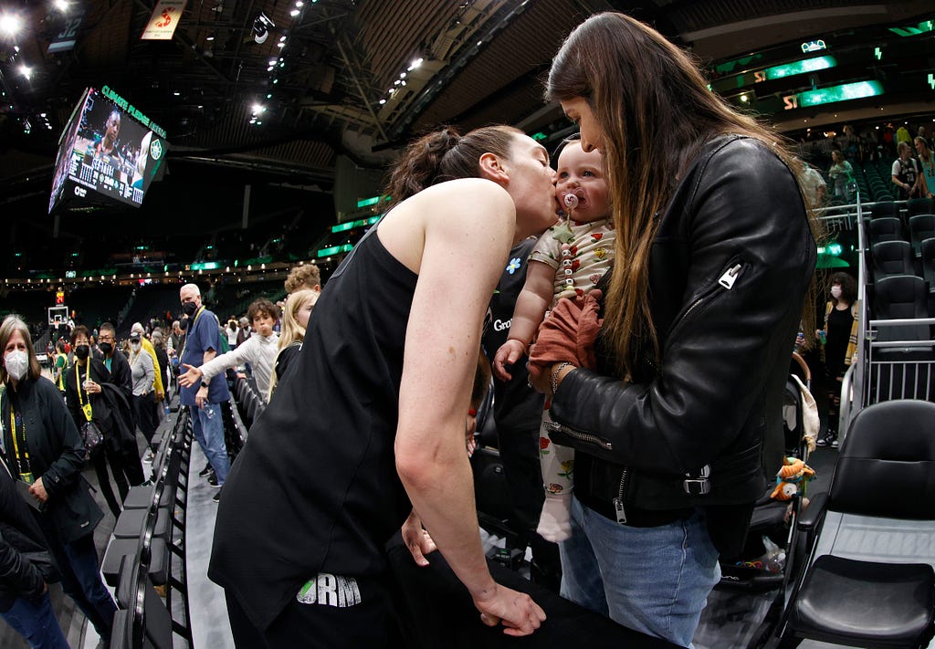 Breanna Stewart visits with her family following a game.