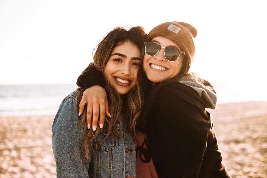 Friendships: two women hugging each other.