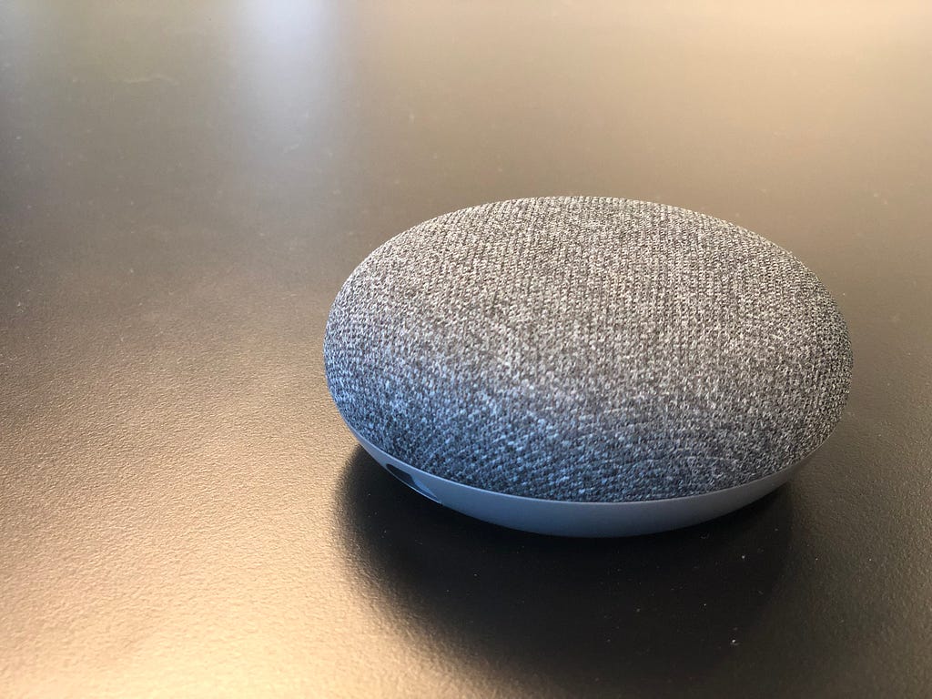 Google Home Mini featuring Google Assistant