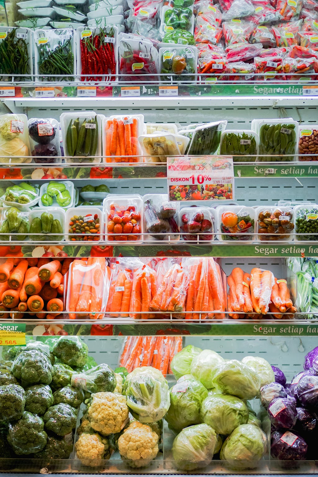 A section in the grocery where frozen fruits and vegetables are stored.