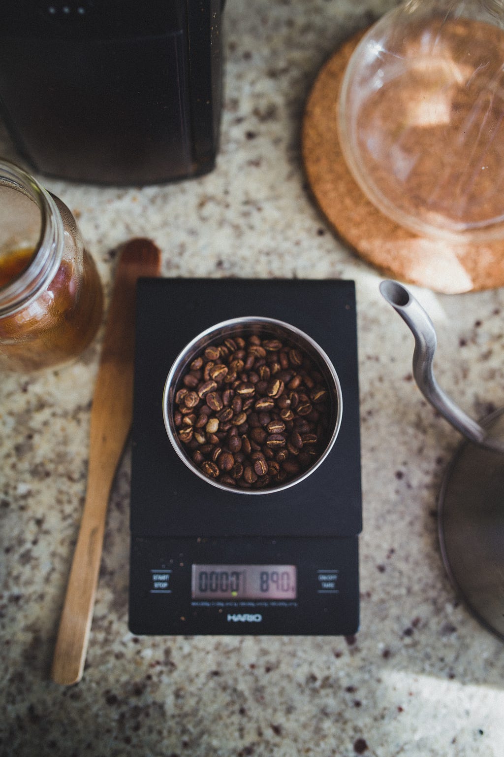 Coffee beans being weighed out on a food scale