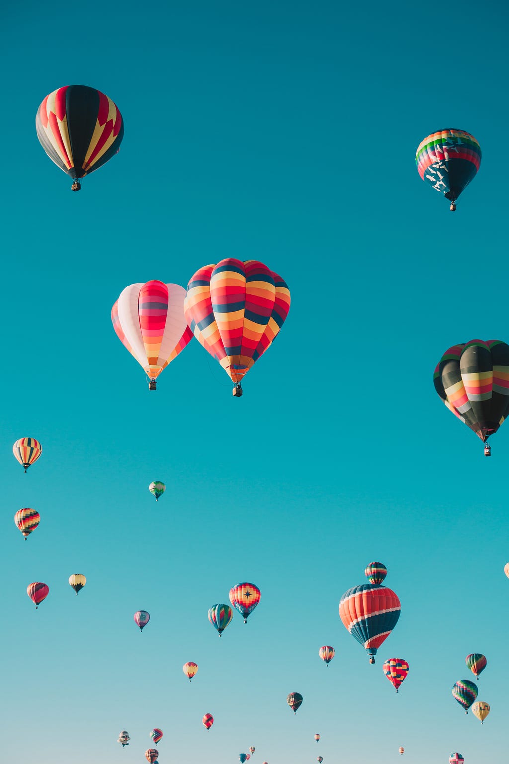 A picture of hot air balloons floating in the air to depict freedom one finds from minimalism and the endless possibilities that the universe has to offer.
