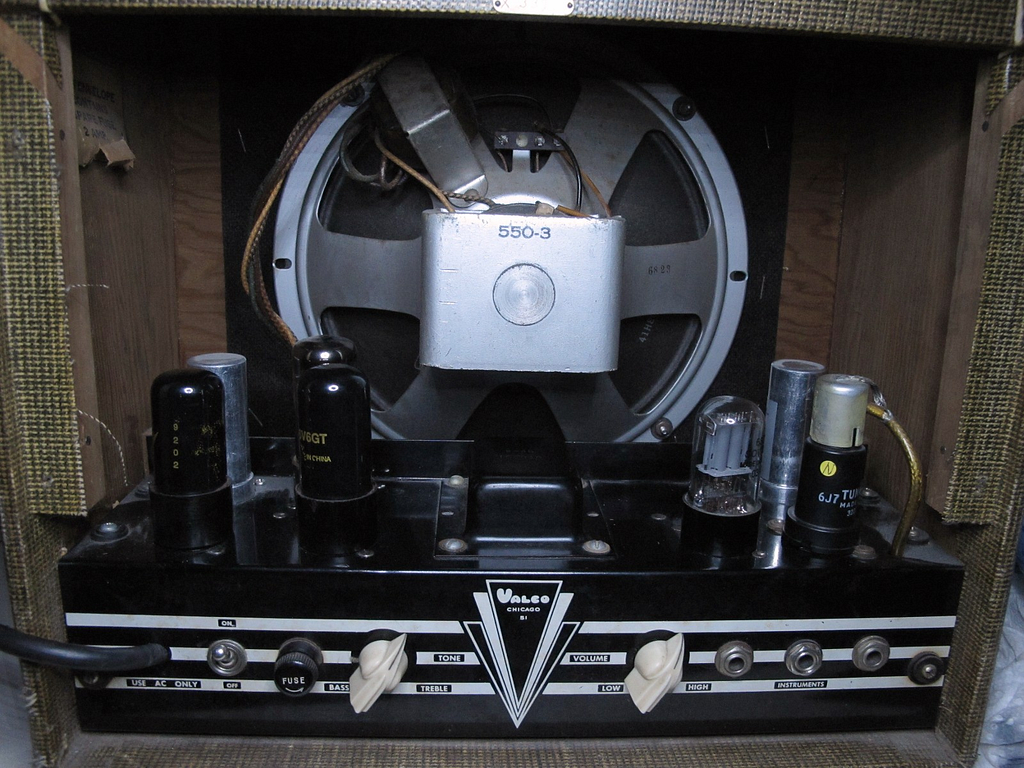 The chassis inside a vintage electric guitar amplifier