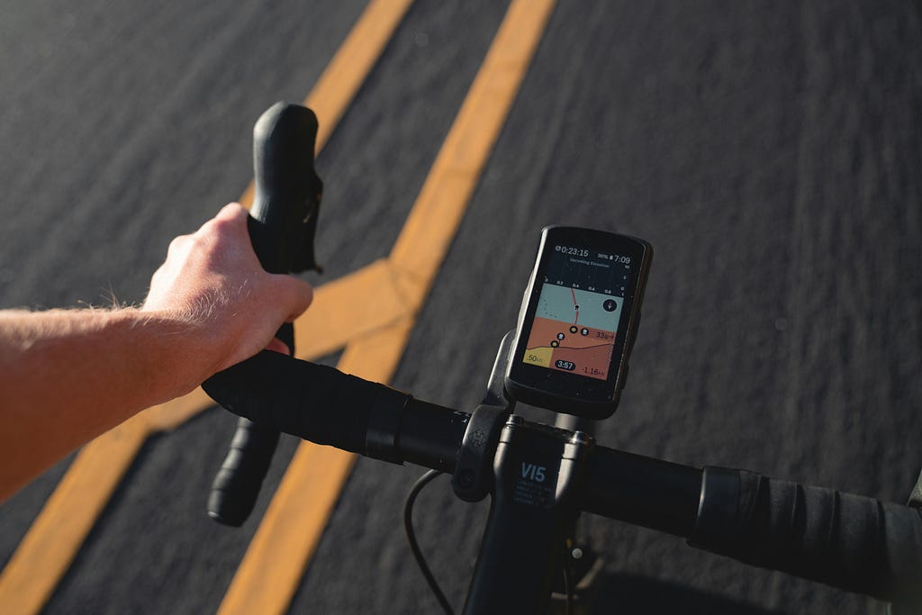 Bike computer on handle bars showing metrics