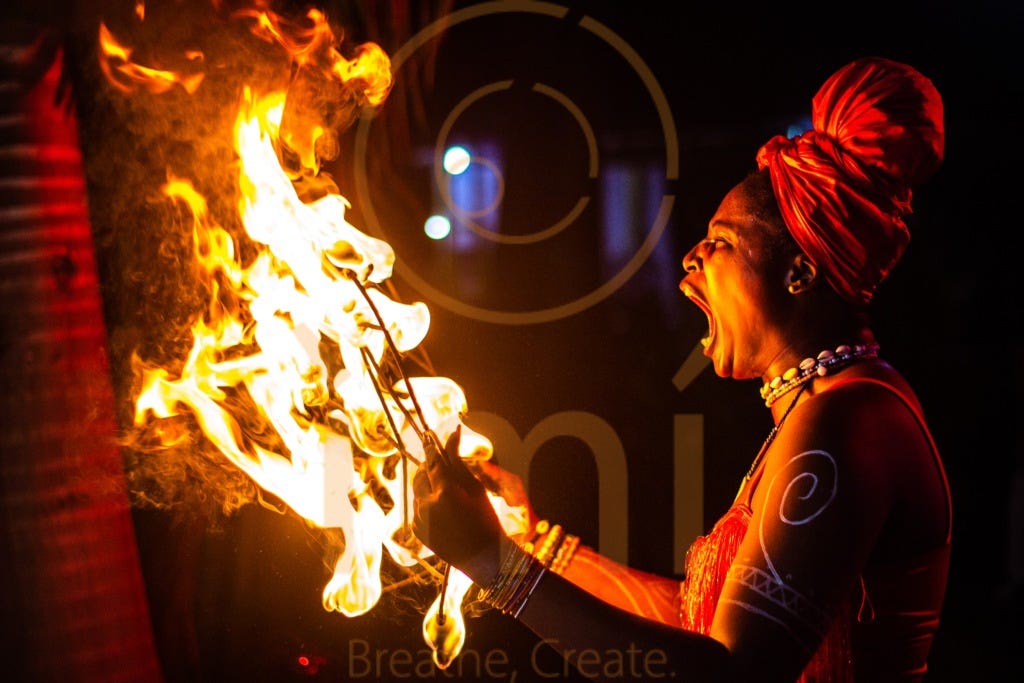 A fire breather screams affirmations