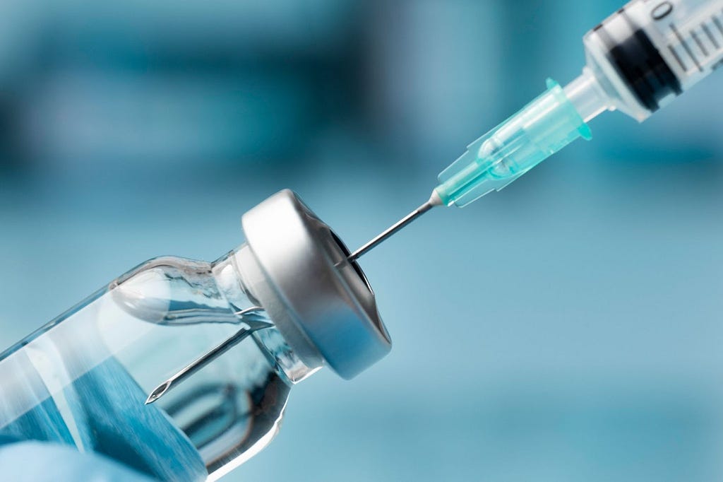 A injection sucking intravenous medicine from bottle.