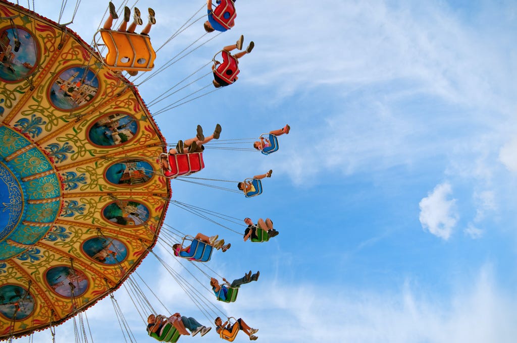 A picture of a giant, colorful merry-go-round from below