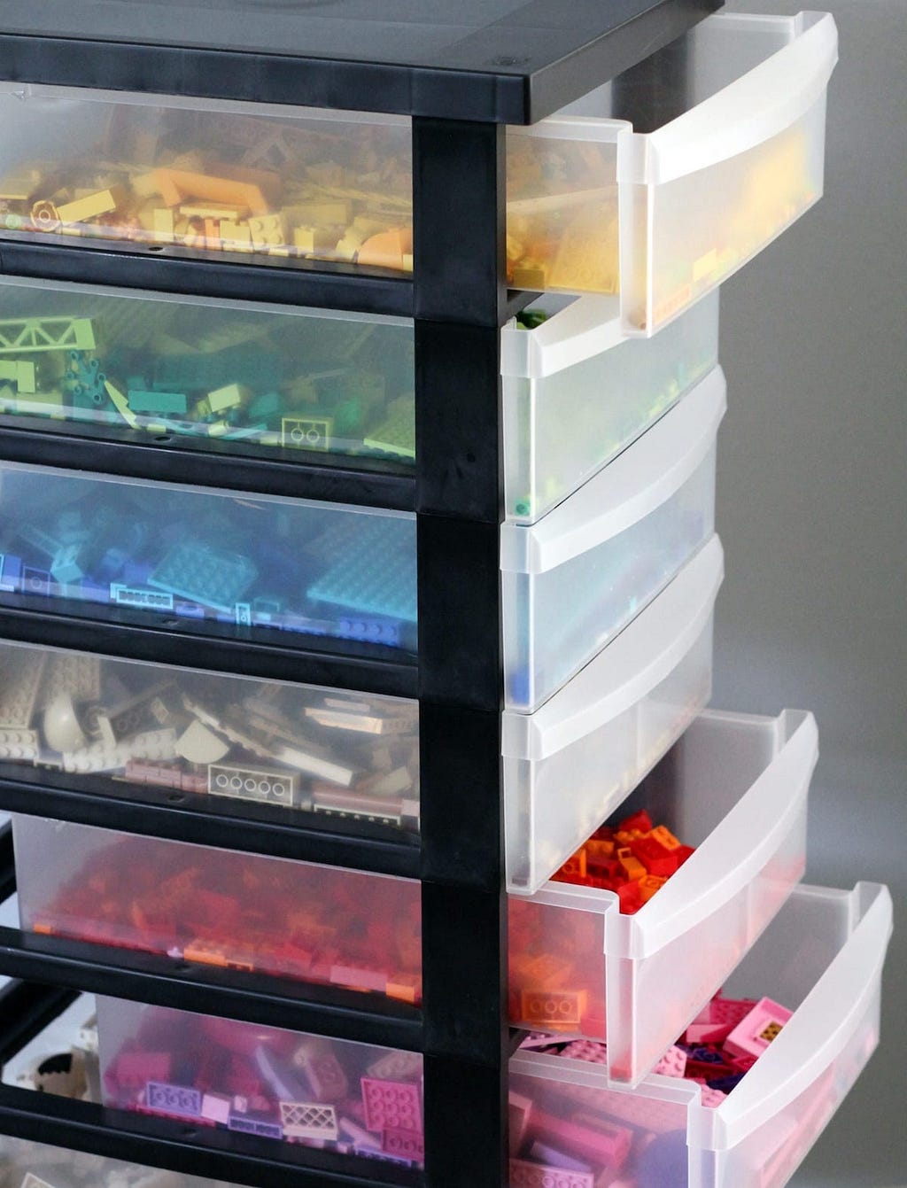 Lego storage boxes grouped by shape and color.