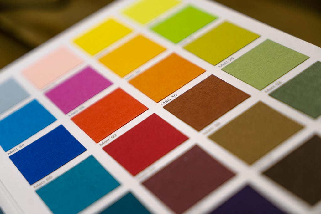 Flat squares of various colors arranged on a paper palette