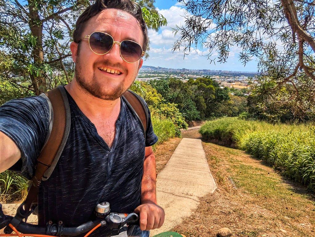 I am pushing the bike up the mountain. The trail was flat and easy.