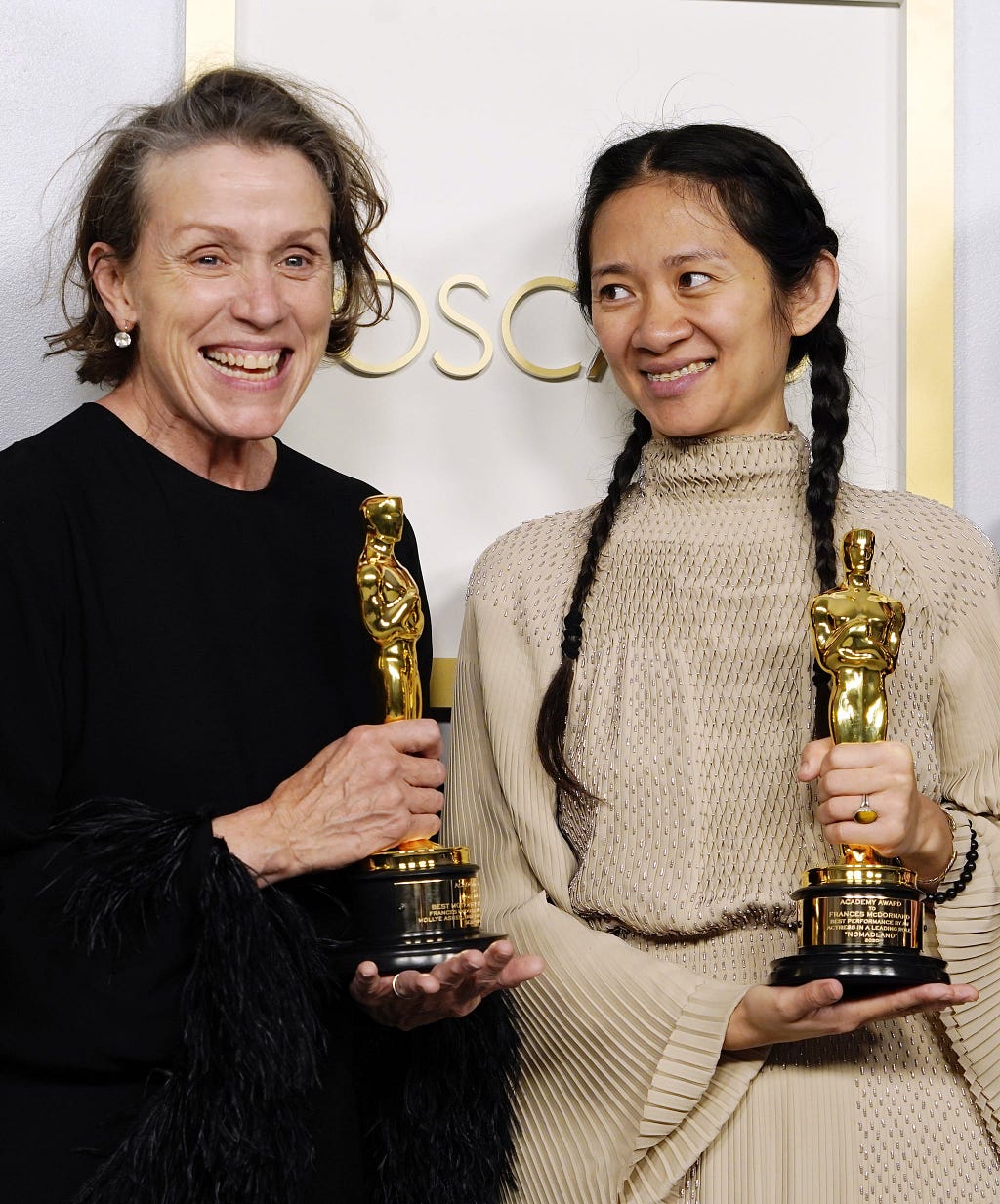 Zhao and McDormand with their awards.