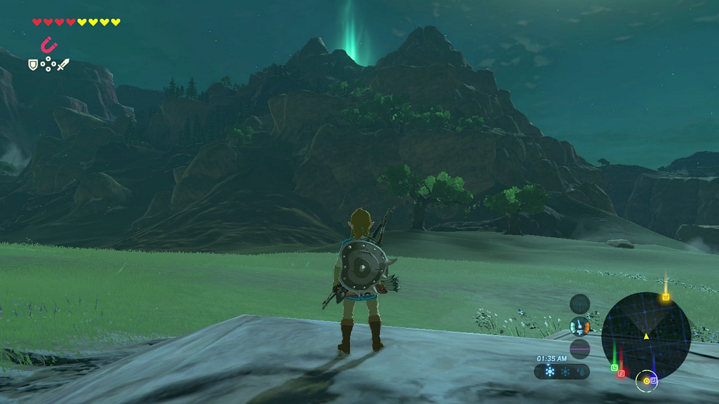 Uma foto de uma gameplay de zelda com link de costas e uma montanha ao fundo no horizonte.