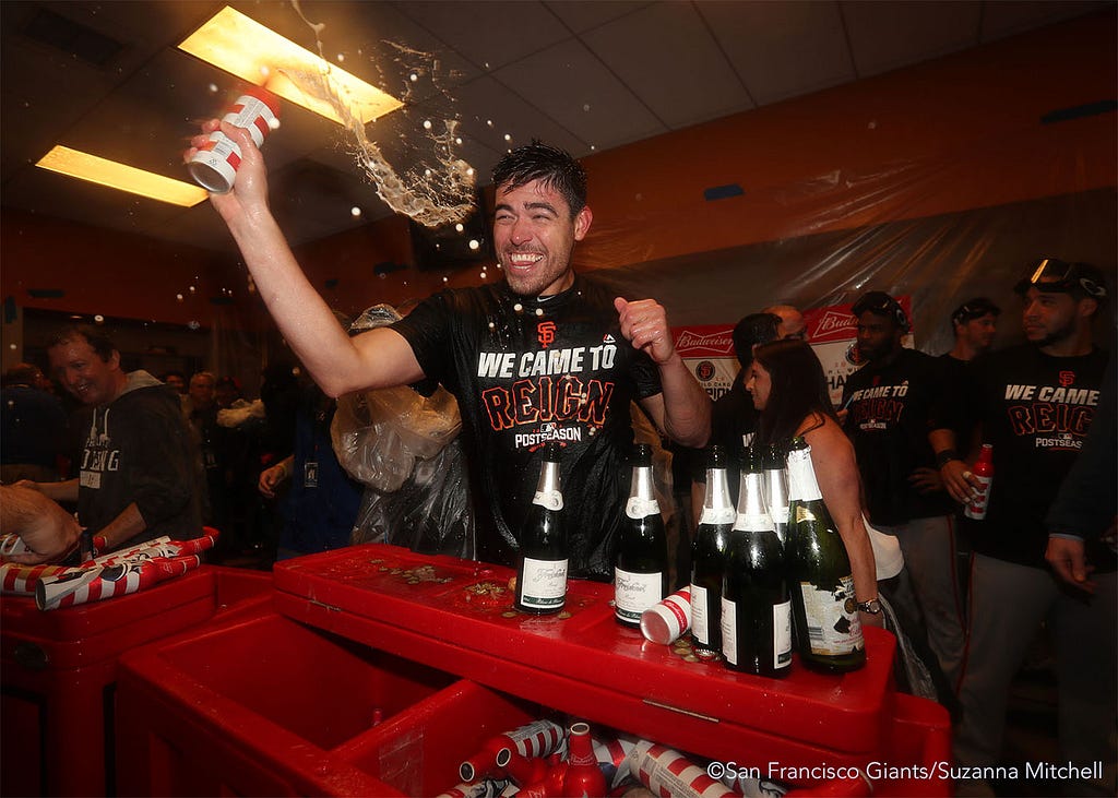 Matt Moore celebrates in the clubhouse.